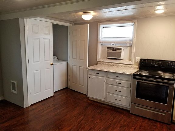 Laundry closet in kitchen.