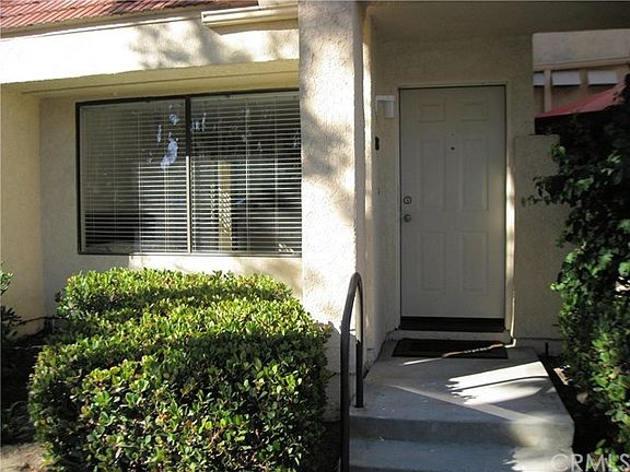Private entrance to this lower level end unit Crystal Cay co