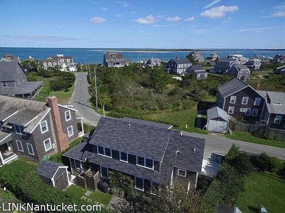 Views out to the beach path and the harbor beyond.