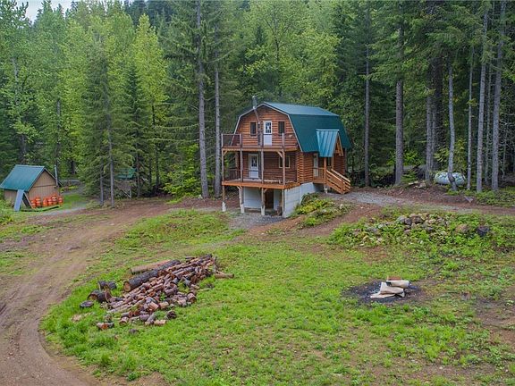 Nearly 1 acre of basically flat land that runs along Roaring Creek. Beautiful newly remodeled cabin in the woods. 