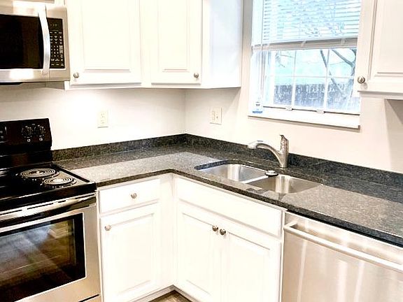 Welcome to your all-new kitchen with a view at 1348 Blair House Court. Granite Countertops, all new flooring, and all new stainless appliances.