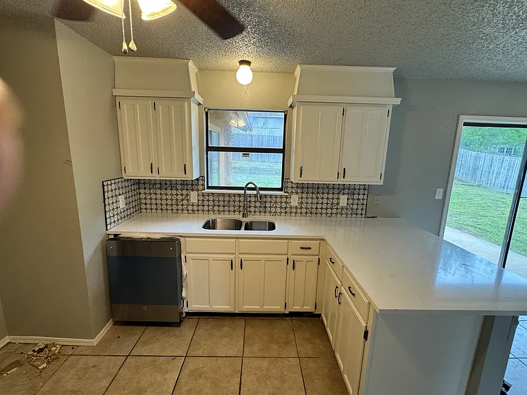 Kitchen, new dishwsher, quartz countertops, repainted cabinets.