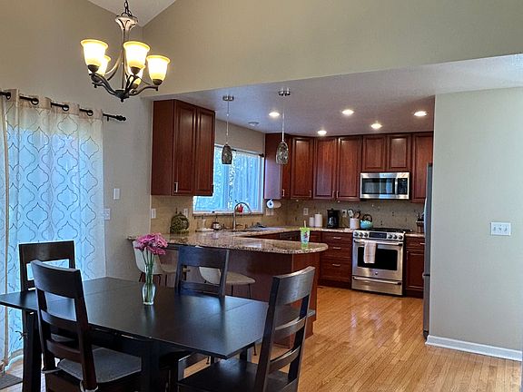 dining area and kitchen. Sliding door to patio and backyard