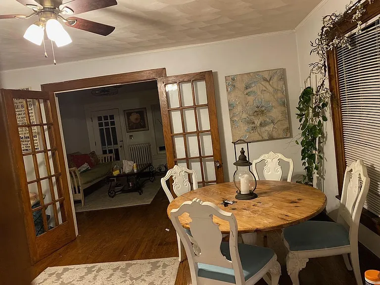 Dining/Den/Sitting Area w/ Designer Ceiling Fan. All trim and doors have been painted white.