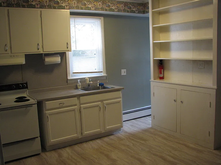 Kitchen (partial view - laundry area behind bookcase)