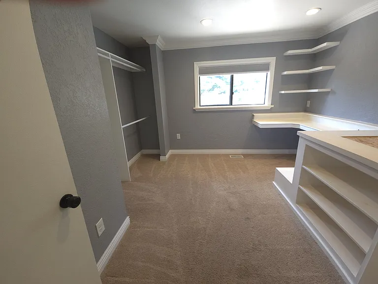 Upstairs bedroom with built im twin size bed and desk