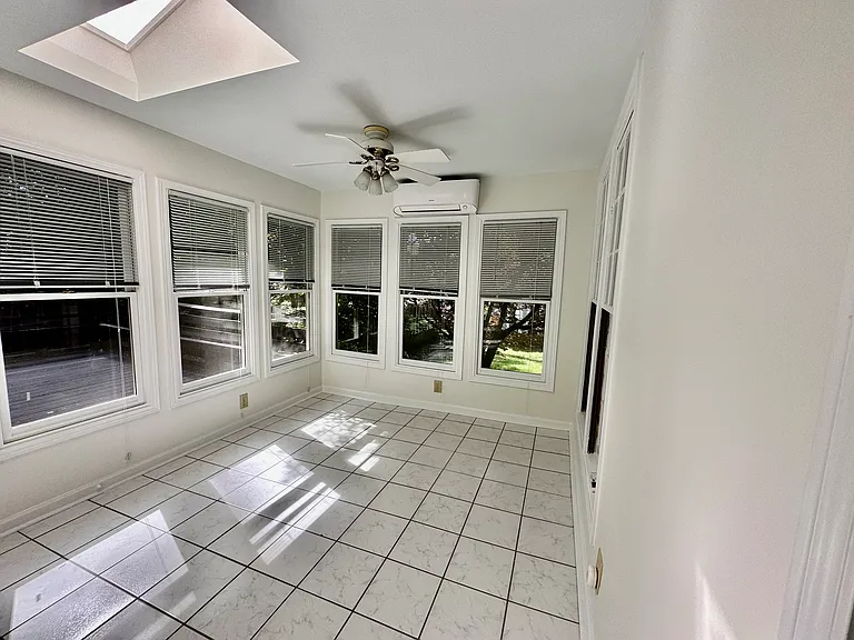 Spacious Sunroom with AC unit.