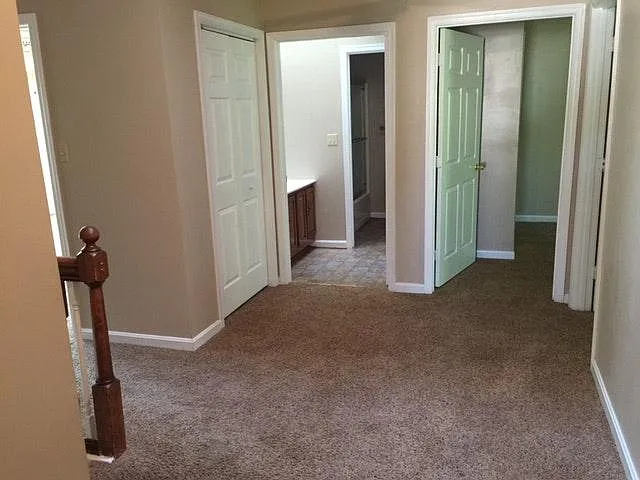 Upstairs, the Landing is large, almost a room of itself. There is access to five bedrooms, a hall bath, and a linen closet. It can almost be a sitting room with a small couch.