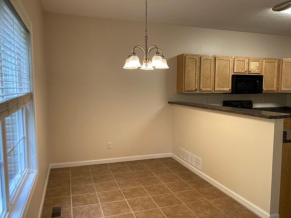 Dining Area leads to Deck w/ Attached Storage Area