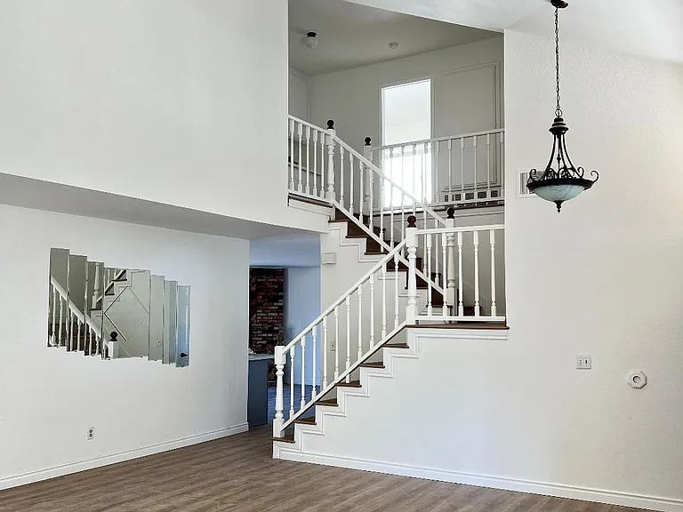 Vaulted ceilings entry way and Living room.