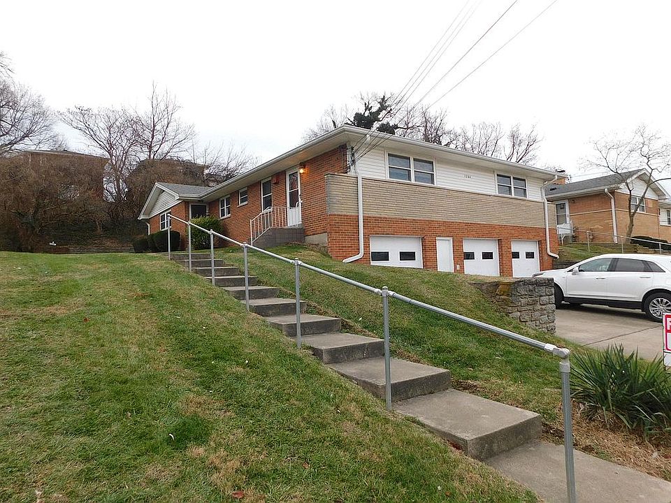 The Apartment is at the top of the steps. This is a 3 family brick building. the garages are a ground level and all three apartments are one the first level. The building to the right has a coin washer and dryer and residents of this building are given