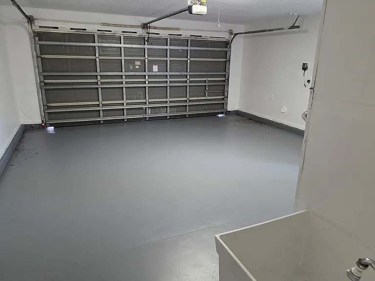 large 2 car garage with laundry tub dryer in garage for efficient drying