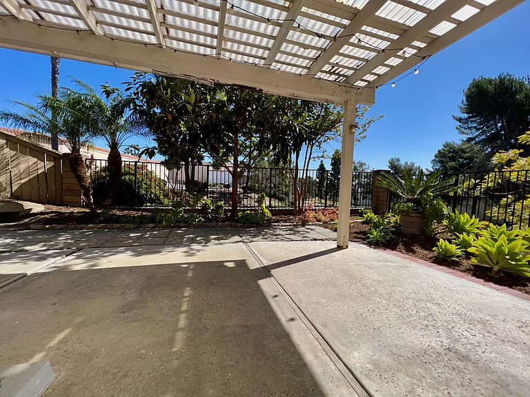 Enjoy a private patio with unobstructed views and the cooling shade of mature trees, providing the perfect space for morning coffee, outdoor dining, or entertaining family and friends.