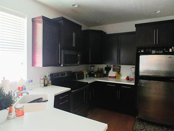 Kitchen- storage cabinets are to the right out of site. Door leads to the one car garage