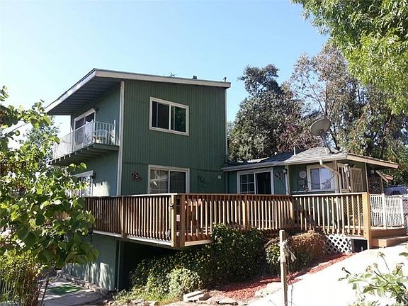 Beautifully and generously built wood deck wrapped around the entire backside facing the valley.