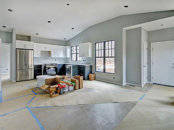 Kitchen with eat in area. Full laundry located in closet