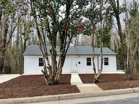 Freshly mulched and treated front yard-- back yard to be cleared and mulched this week.