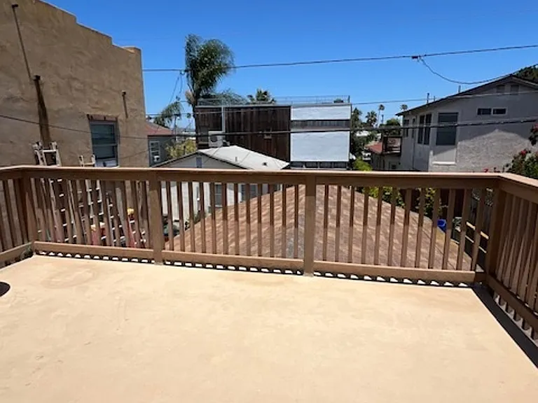 Rear-facing upstairs deck off of second upstairs bedroom