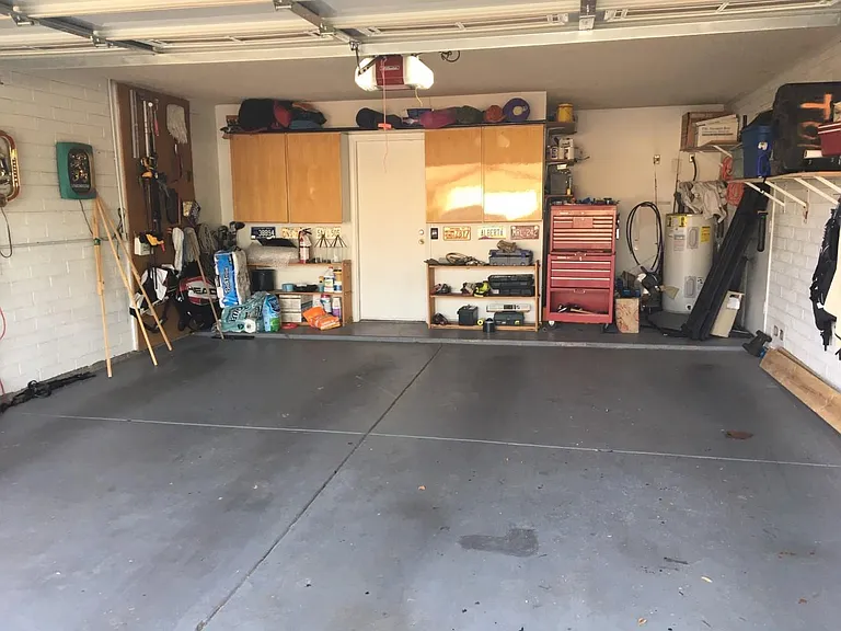 Storage Cabinets and heavy duty shelving in attached garage
Newer overhead door with keypad and wifi connectivity