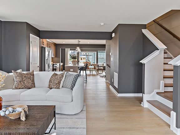 Spacious living room in a York II King s Crossing Townhome by DRB Homes, modern decor in Charles Tow