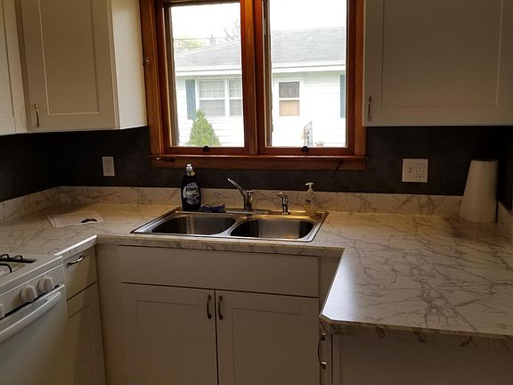 Kitchen window overlooks courtyard