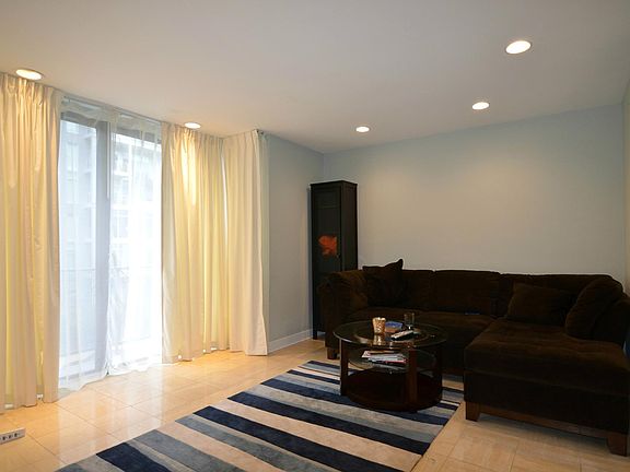 Bright living room with large windows and abundant natural light