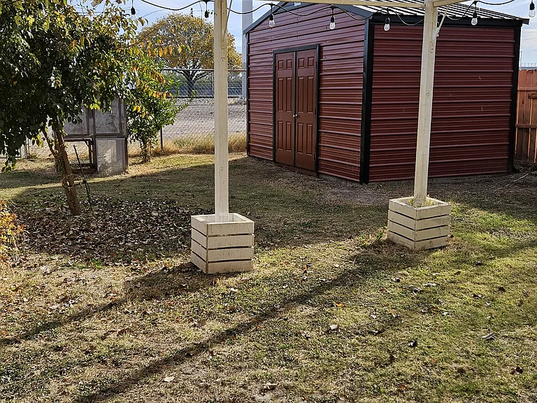 Backyard with extra large storage shed