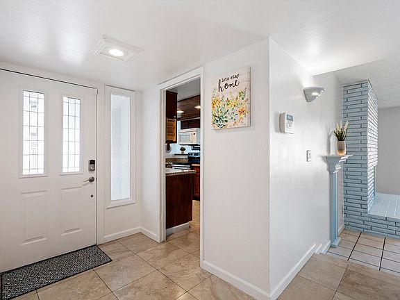 Entryway, providing a welcoming space and giving a glimpse into adjacent areas.