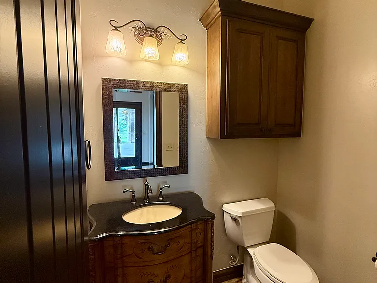 This is the 3rd bathroom. All bathrooms have higher toilets, fantastic storage and good lighting. Great access next to the garage door, off the kitchen and close to the backyard doors. If kids are dirty, they don't track anything through the rugs.