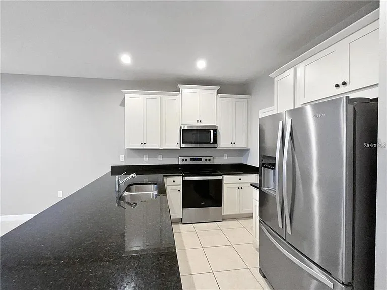 2424 Blowing Breeze Ave — Photo 11