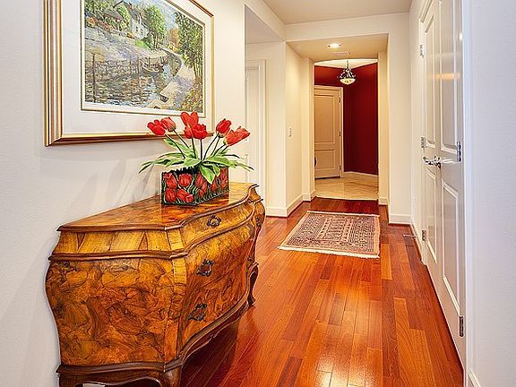 Brazillian cherry floors lead you through the kitchen and to the den/office.