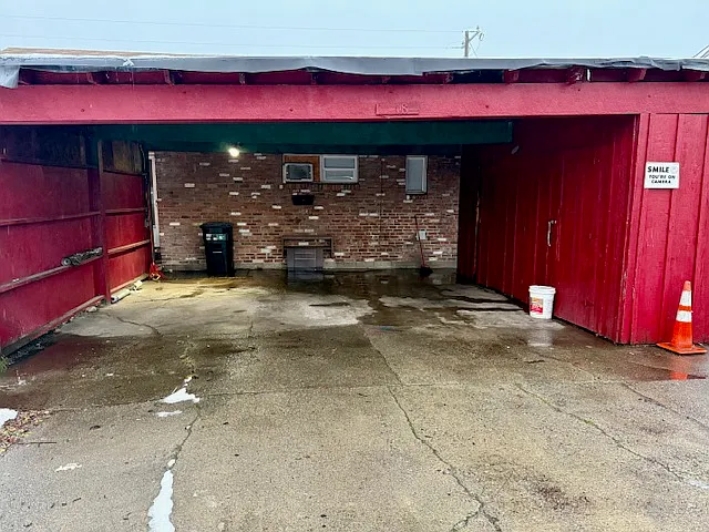 Carport parking space and storage shed