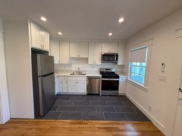 VIEW OF UPGRADED KITCHEN FROM LIVING ROOM