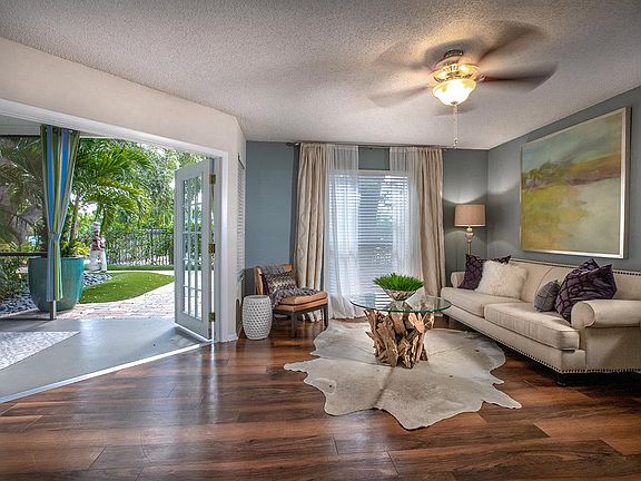 Your spacious living room has a sliding glass door leading to your very own private lanai.