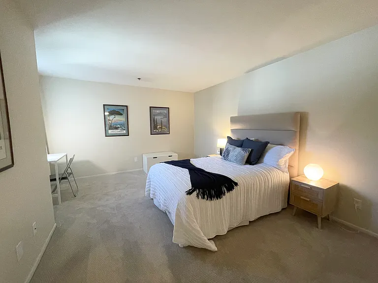 Second bedroom with double nightstands and work space