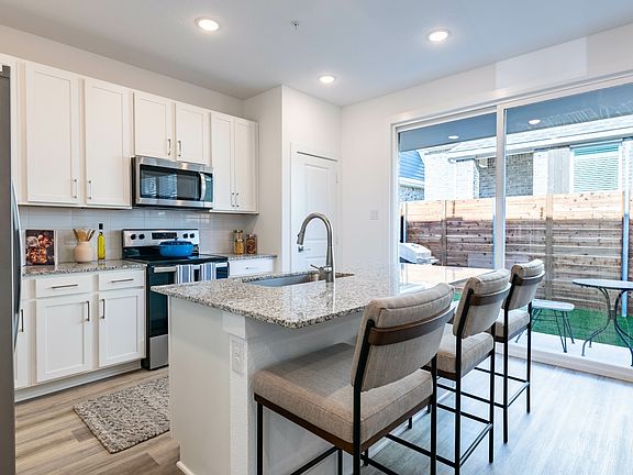 Embrace the modern convenience of a single-basin sink paired with a sleek pull-down faucet.