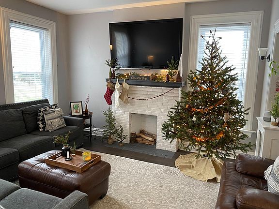 2nd Floor Living Room at Christmas with fireplace and mounted big screen