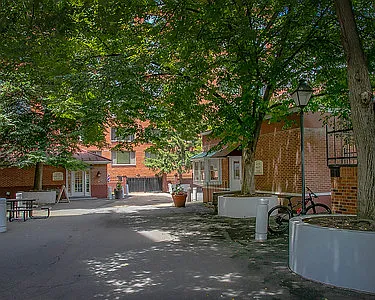 The leafy, on-site "commercial village" includes a grocery store, coffee shop, and hair salon.