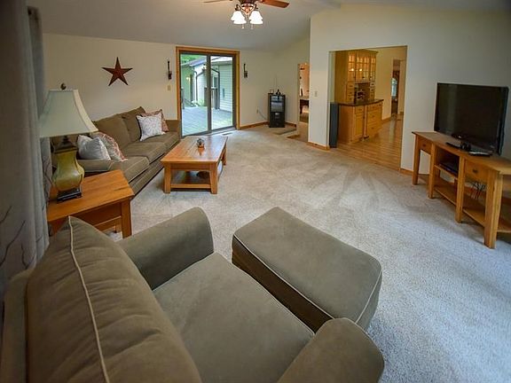 Open and airy this living room offers plenty of space with 2 accesses to the out doors.