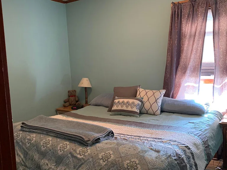 one of two bedrooms with king bed
