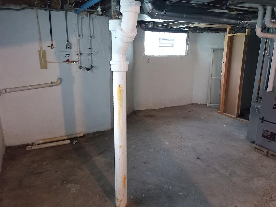 Shared basement area with separate washer and dryer hookups.