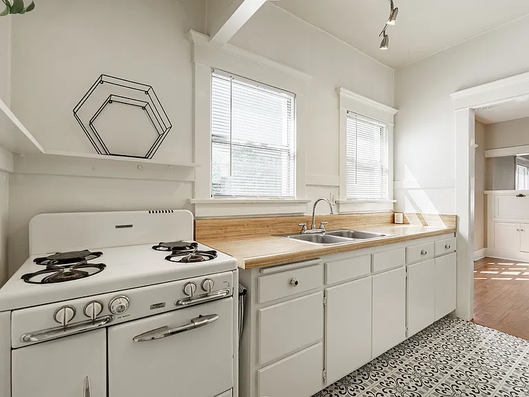 Kitchen with windows overlooking the side yard