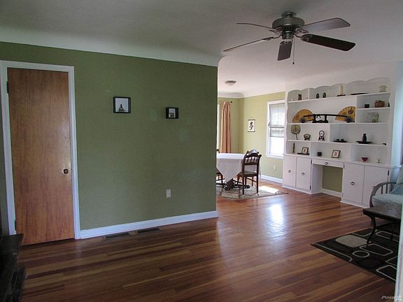 Living Room: Gleaming hardwood floor and cove ceilings!