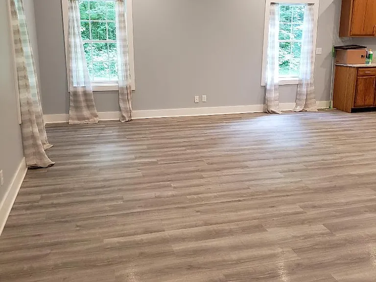 Open concept living room, dining room, kitchen 21' x 28'. Plenty of space for a sofa bed.