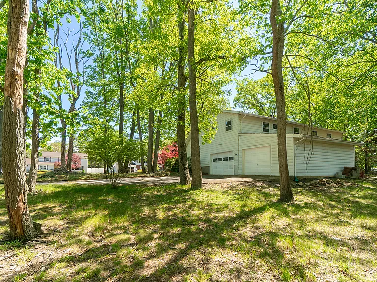 east side of home has driveway and 2 garages