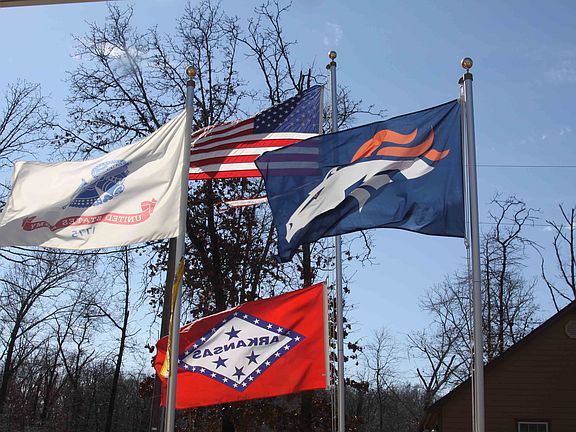 3 flagpoles in front