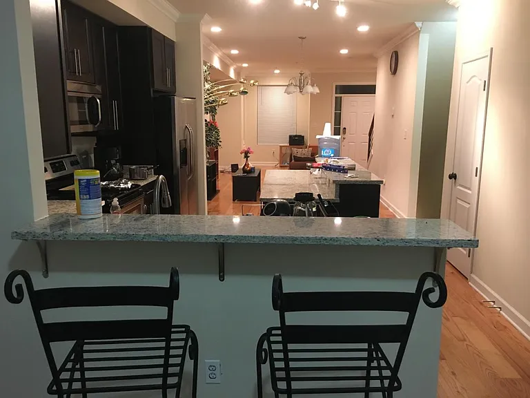 view of kitchen and living room from dining room
