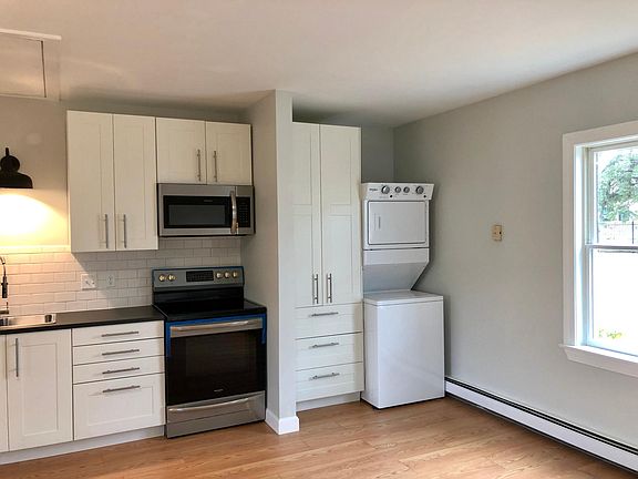 Built-in wardrobe with stacked washer/dryer.
