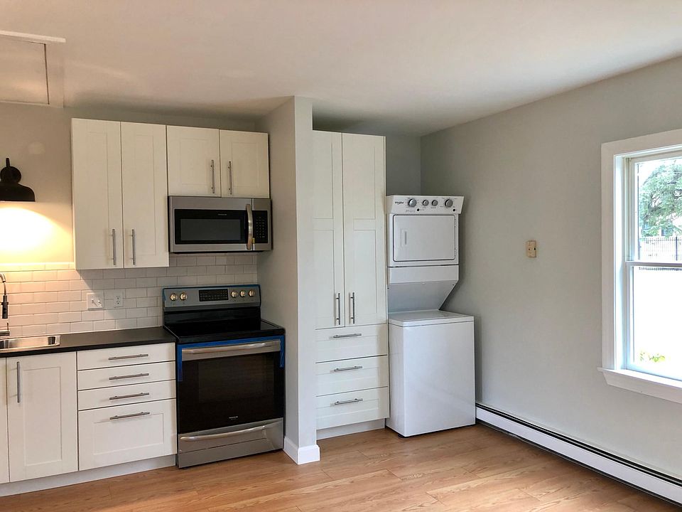 Built-in wardrobe with stacked washer/dryer.