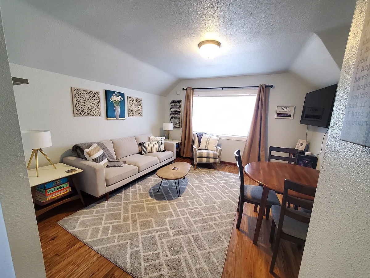 Photo 2 of 27 - 1208 2nd Ave S #2 - Fargo, ND Bright Living Room with Dining Area - 1208 2nd Ave S #2